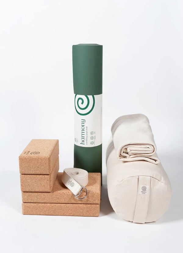 Ekotex yoga accessories including a mat, block, strap and bag on a white background
