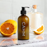 CAHM Citrus, Musk & Patchouli Hand & Body Lotion on display