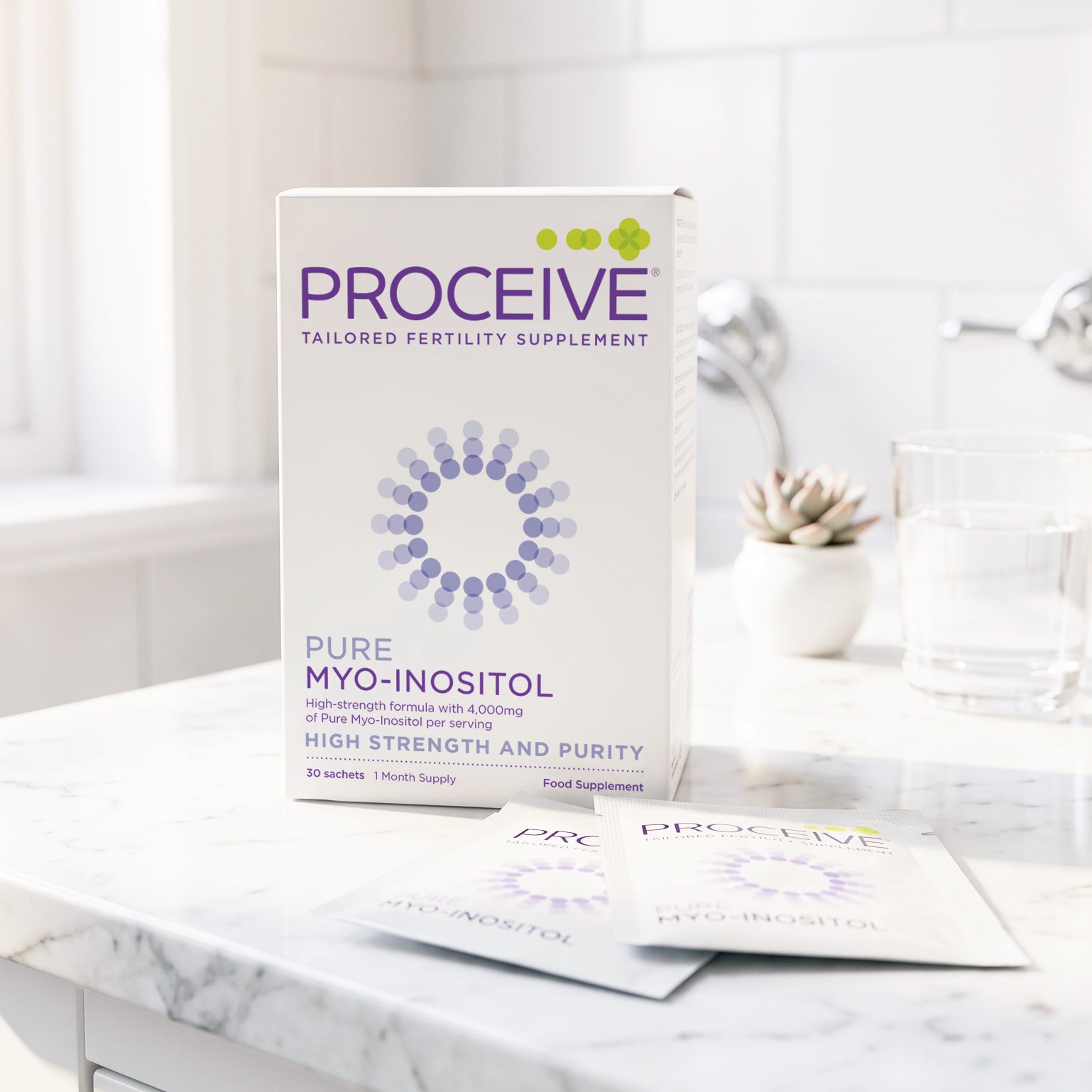 A box of ProCeive Pure Myo-Inositol dietary supplement stands on a marble countertop with two sachets in front, alongside a glass of water and a small potted succulent in a bright kitchen setting.