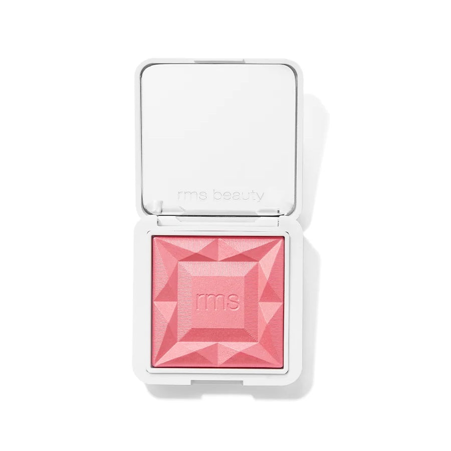 An open RMS Beauty diamond-shaped blush compact showing a vibrant pink pressed powder, set against a clean white background.