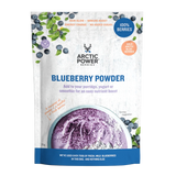A 700g stand-up pouch of Arctic Power Berries Blueberry Powder, featuring a white textured background with blueberry illustrations, a bowl of purple-blueberry smoothie, and blueberry graphics.