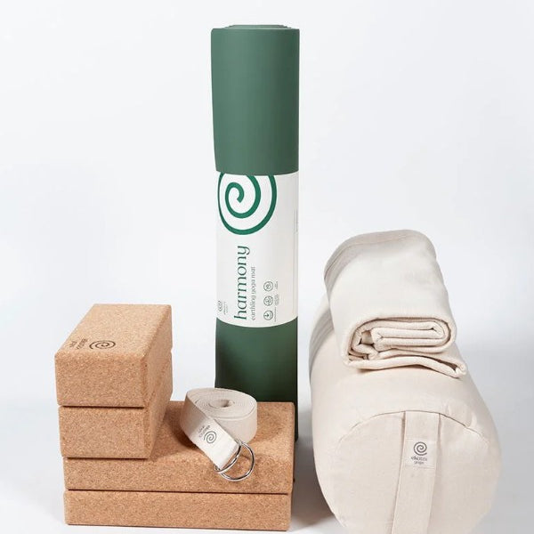 Ekotex yoga accessories including a mat, block, strap and bag on a white background
