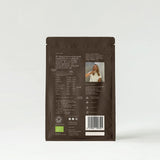 Brown package of Holy Cacao with white text on a light gray background