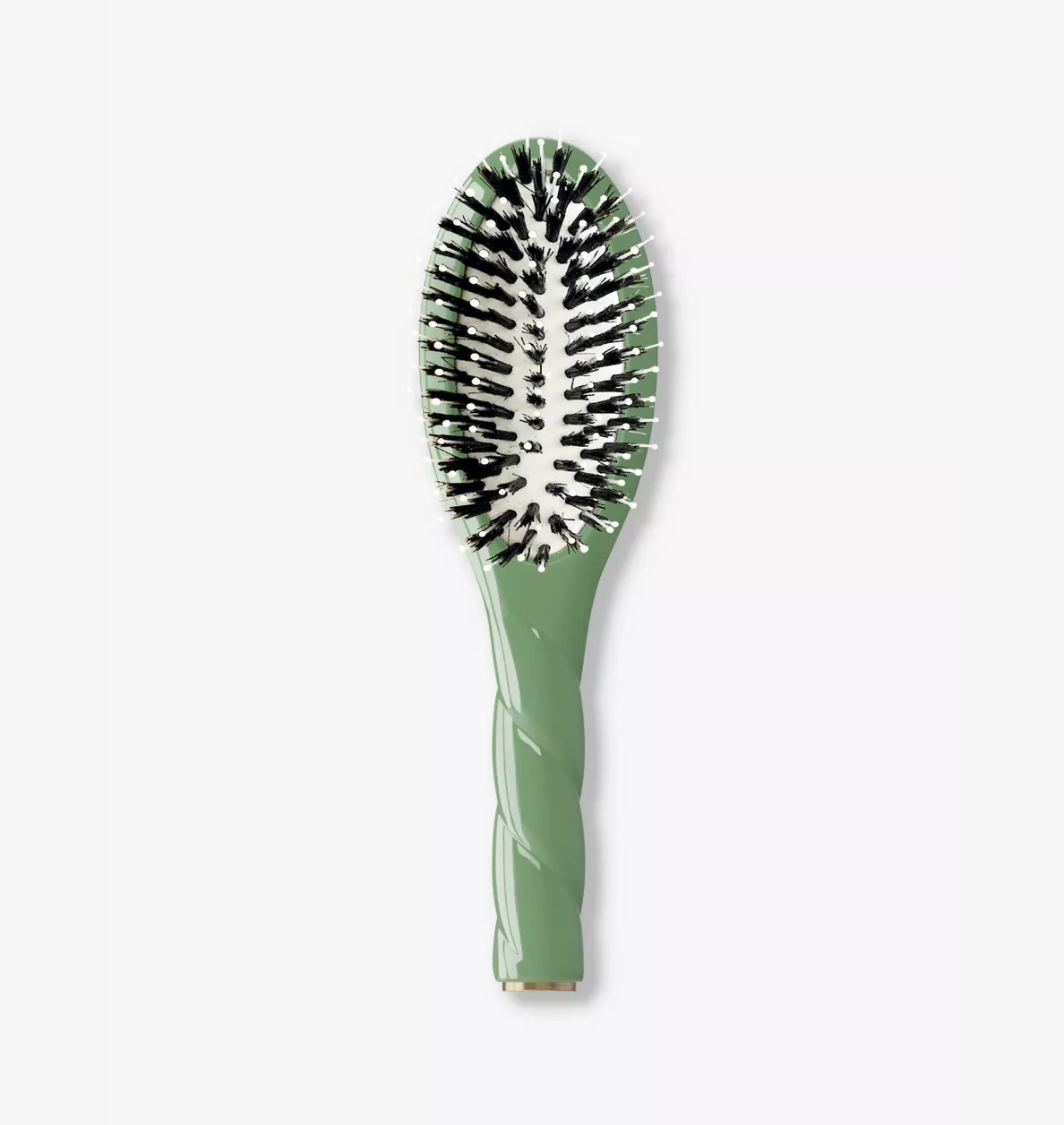 A green hairbrush with black and white bristles, featuring a textured handle and a gold accent at the base, shown on a light gray background.