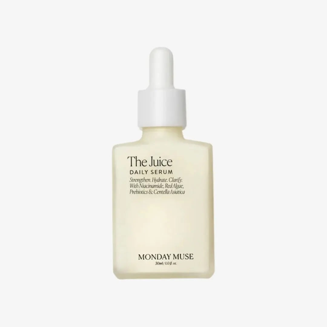Monday Muse The Juice Daily Serum in a frosted glass bottle with a white dropper cap, shown against a plain light gray background.