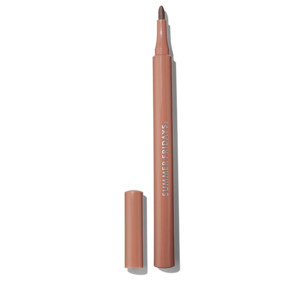 A nude pink cosmetic lip liner pencil with its cap removed, standing vertically next to it on a clean white background. The brand name 'SUMMER FRIDAYS' is printed vertically on the barrel.