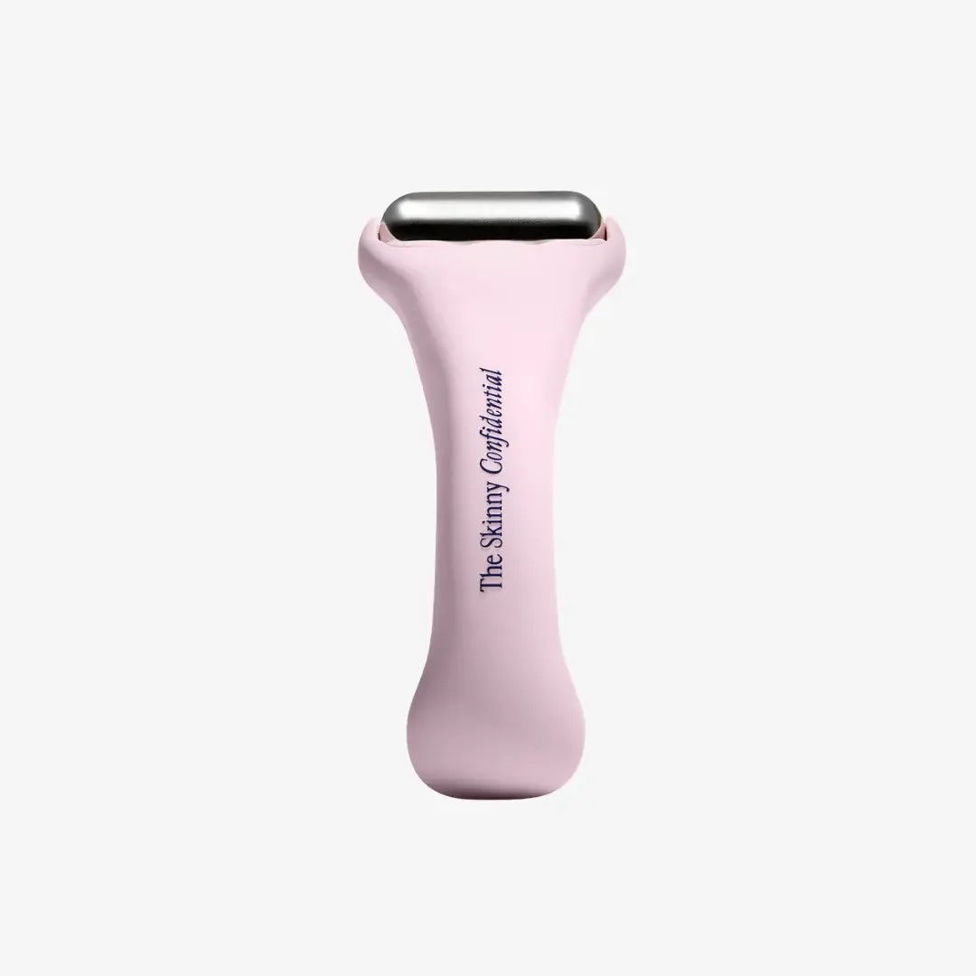 Pink skin care tool with 'The Skinny Confidential' branding on a white background