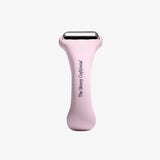 Pink skin care tool with 'The Skinny Confidential' branding on a white background